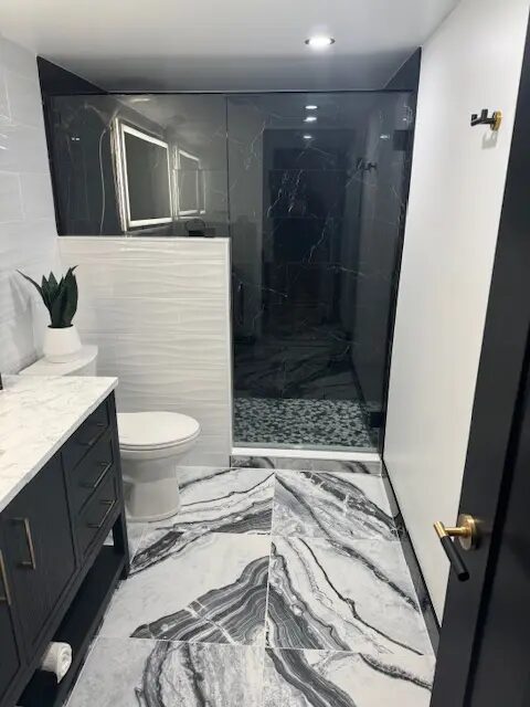 Completed bathroom shower and vanity detailing