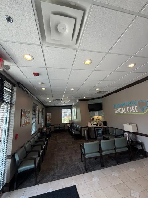 Dental-office waiting area with seating and a finished ceiling